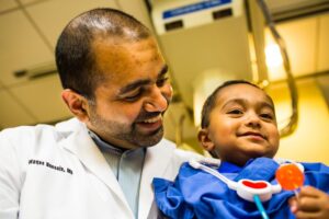 Dr. Waqas Hussain and his son, Humza